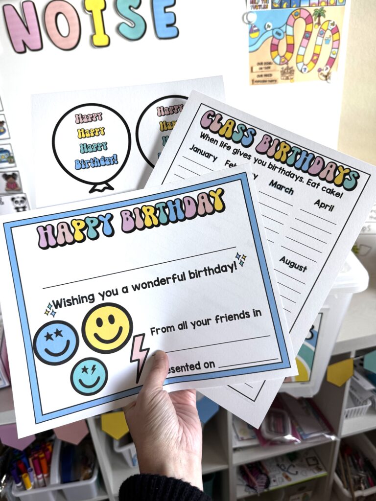 a certificate that say happy birthday, a paper that says class birthdays, and balloons that say happy happy happy birthday