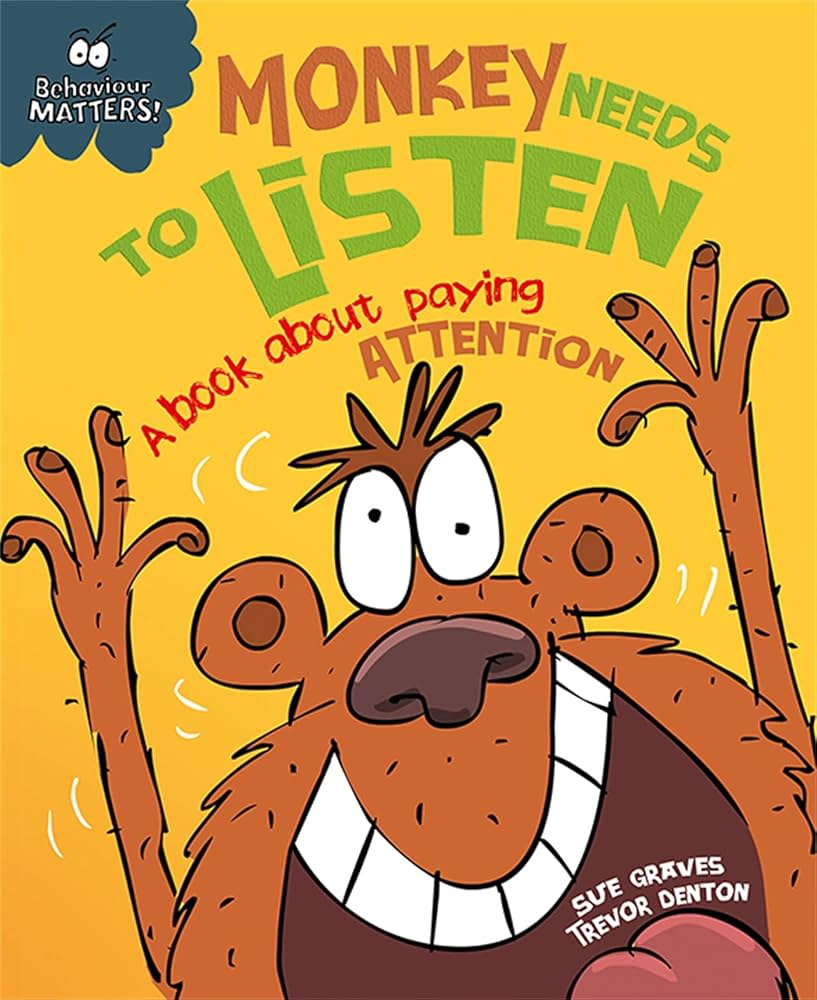 a monkey with his arms raised on the cover of a book