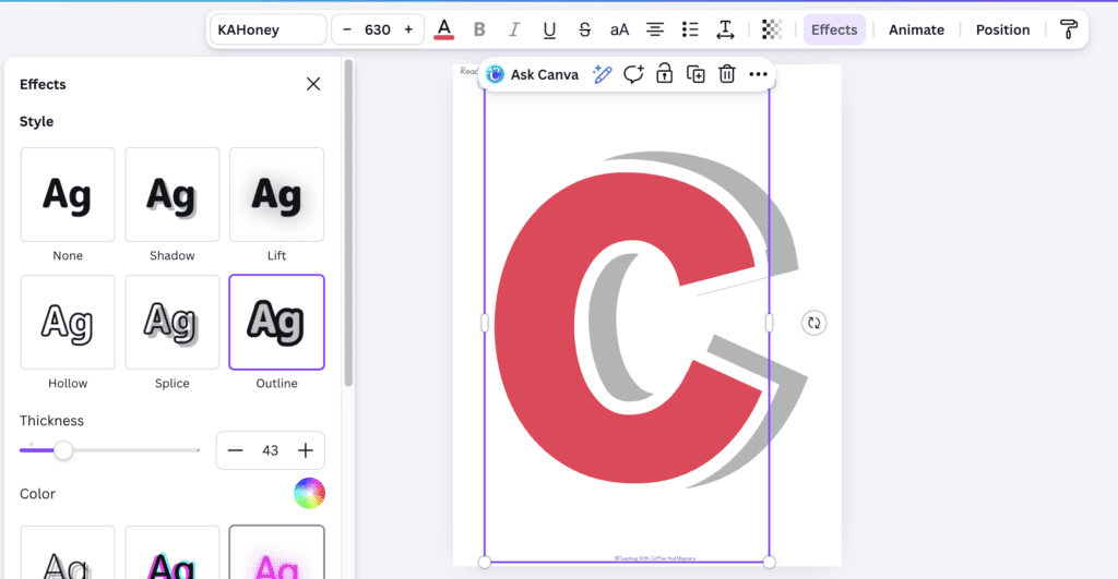 Canva interface with a duplicate letter in red with the effect outline chosen in the color white with thickness at 43